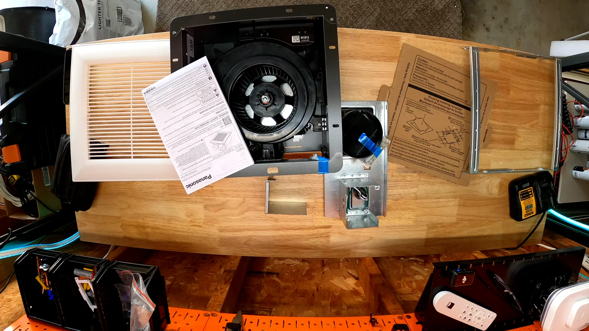 WhisperFit fan-only components laid out on a workbench
